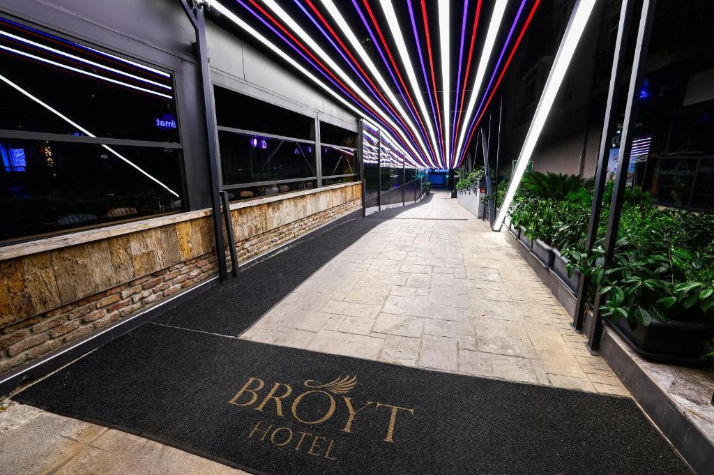 a sign on a sidewalk in front of a hotel at Broyt Hotel in Istanbul