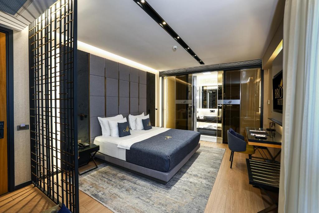 a bedroom with a bed and a desk in a room at Broyt Hotel in Istanbul