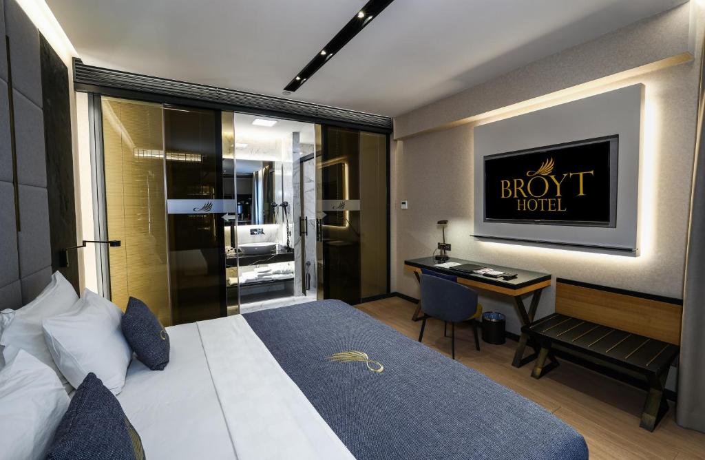 a hotel room with a bed and a desk at Broyt Hotel in Istanbul