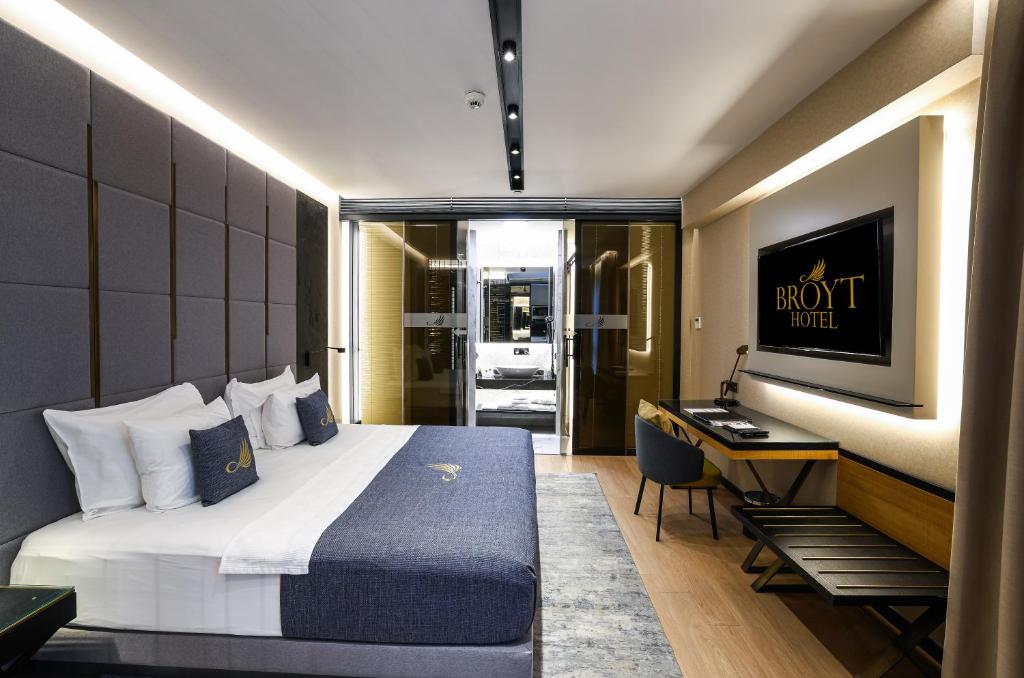 a hotel room with a bed and a desk at Broyt Hotel in Istanbul