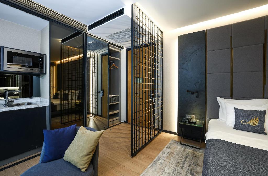 a hotel room with a bed and a bathroom at Broyt Hotel in Istanbul