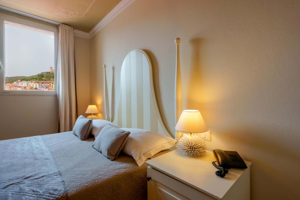 Giường trong phòng chung tại Palazzo Pischedda