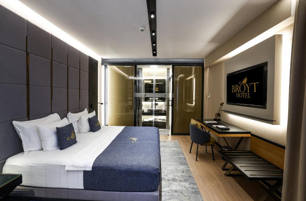 a hotel room with a bed and a desk at Broyt Hotel in Istanbul