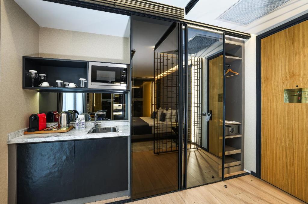 a kitchen with a sink and a counter top at Broyt Hotel in Istanbul