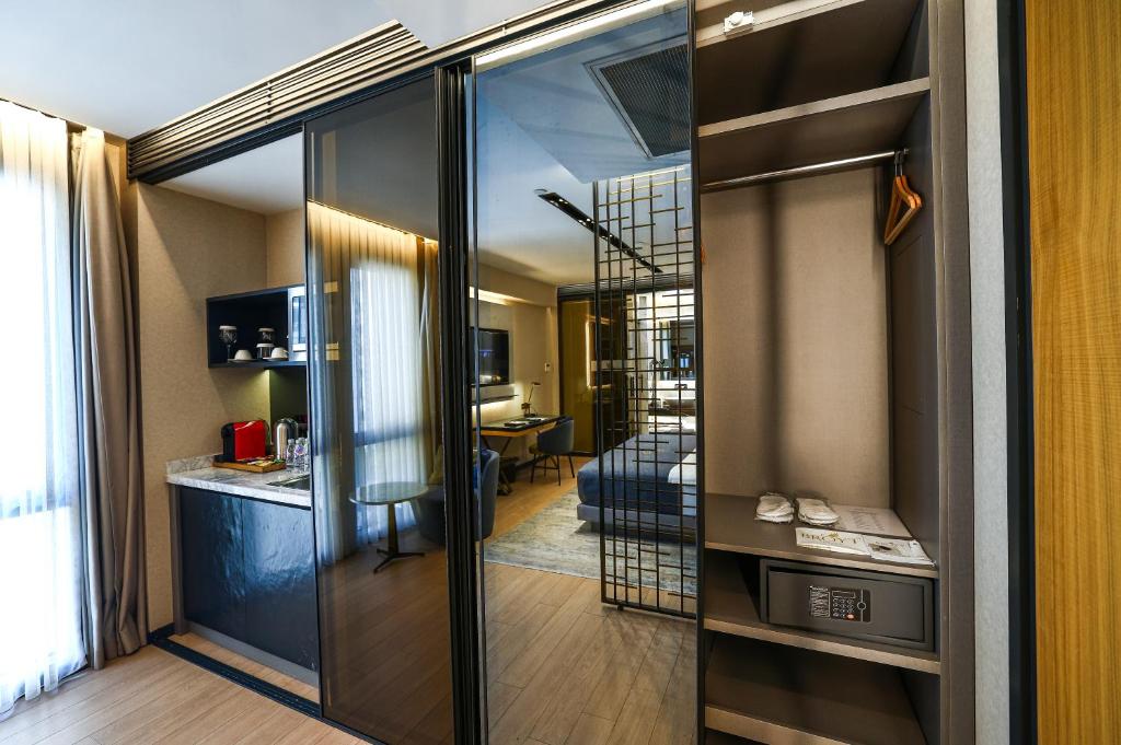 a room with a sliding glass door leading to a living room at Broyt Hotel in Istanbul