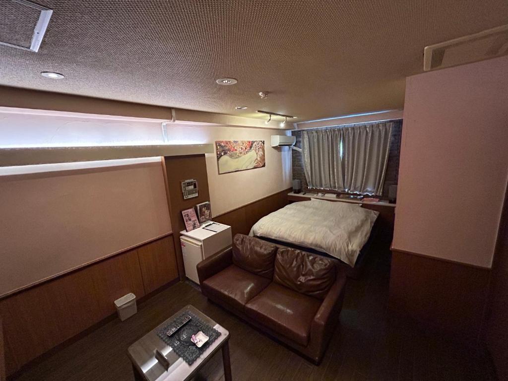 Hotel Sunday Brunch (Adult Only)客房内的一张或多张床位