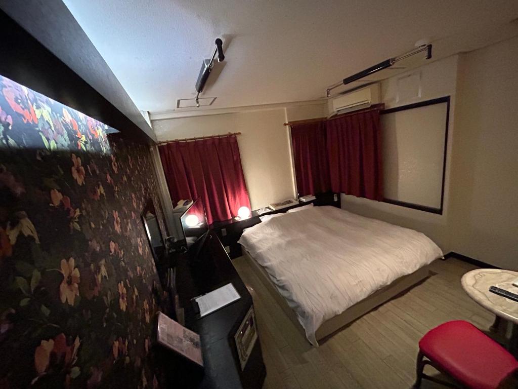Hotel Sunday Brunch (Adult Only)客房内的一张或多张床位