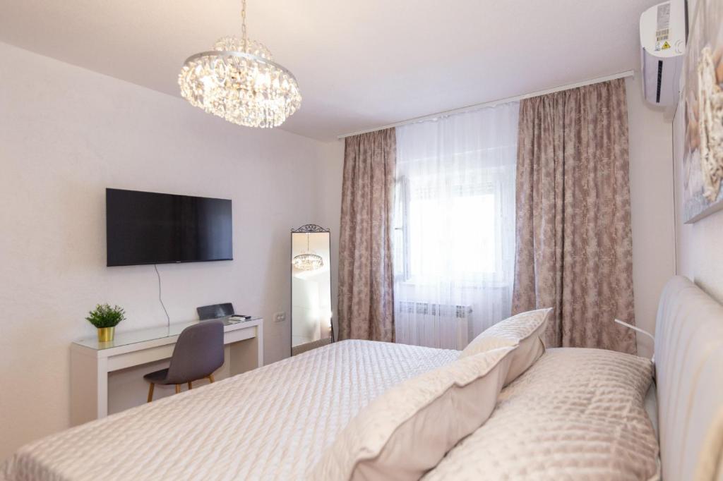 Postel nebo postele na pokoji v ubytování Apartman Dragomir