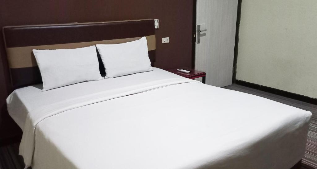 Postel nebo postele na pokoji v ubytování Hotel Syariah GS HERITAGE, Kota Metro