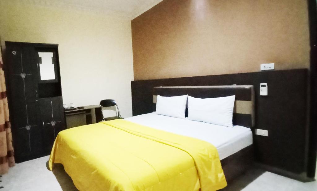 Postel nebo postele na pokoji v ubytování Hotel Syariah GS HERITAGE, Kota Metro