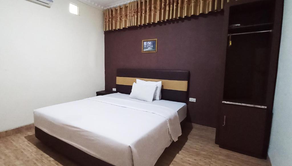 Postel nebo postele na pokoji v ubytování Hotel Syariah GS HERITAGE, Kota Metro