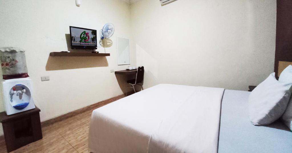 Postel nebo postele na pokoji v ubytování Hotel Syariah GS HERITAGE, Kota Metro
