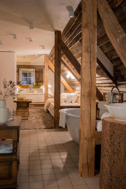 Postel nebo postele na pokoji v ubytování Posthotel Alexander Herrmann