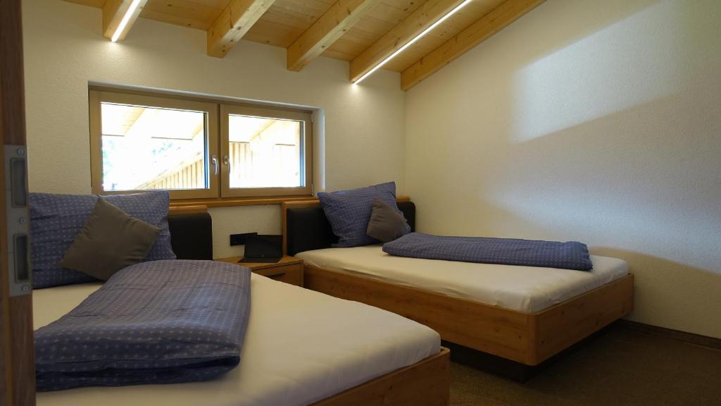 Postel nebo postele na pokoji v ubytování Kaunergrat Appartement