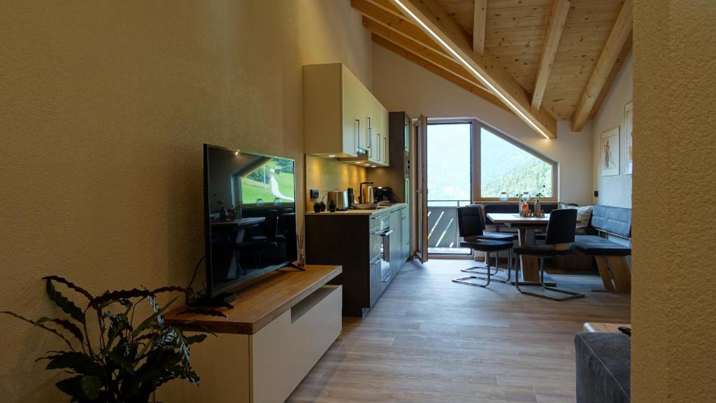 TV a/nebo společenská místnost v ubytování Kaunergrat Appartement