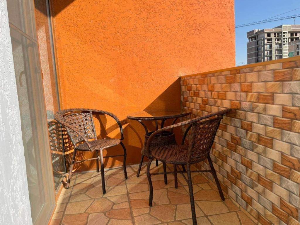 two chairs and a table on a balcony at My Sweet Home In Rustavi sity 2 in Rustavi