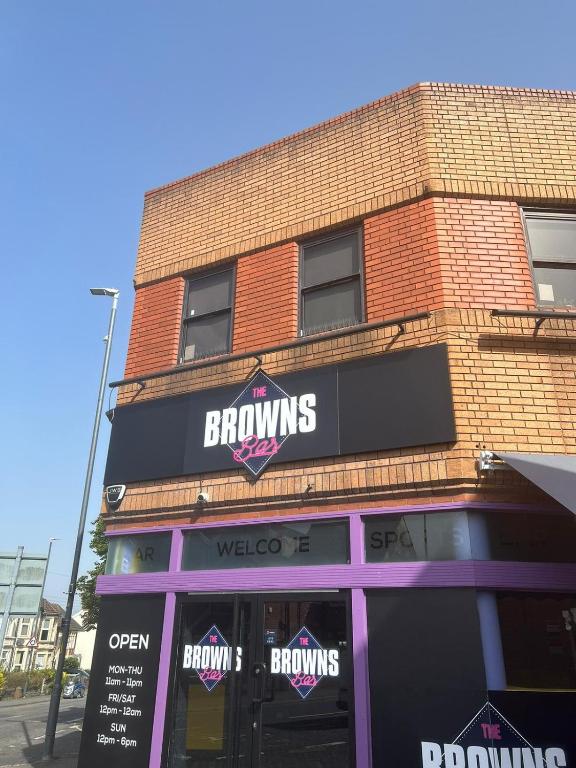 a brick building with a browniants sign on the front of it at OYO Rooms Kingswood in Bristol