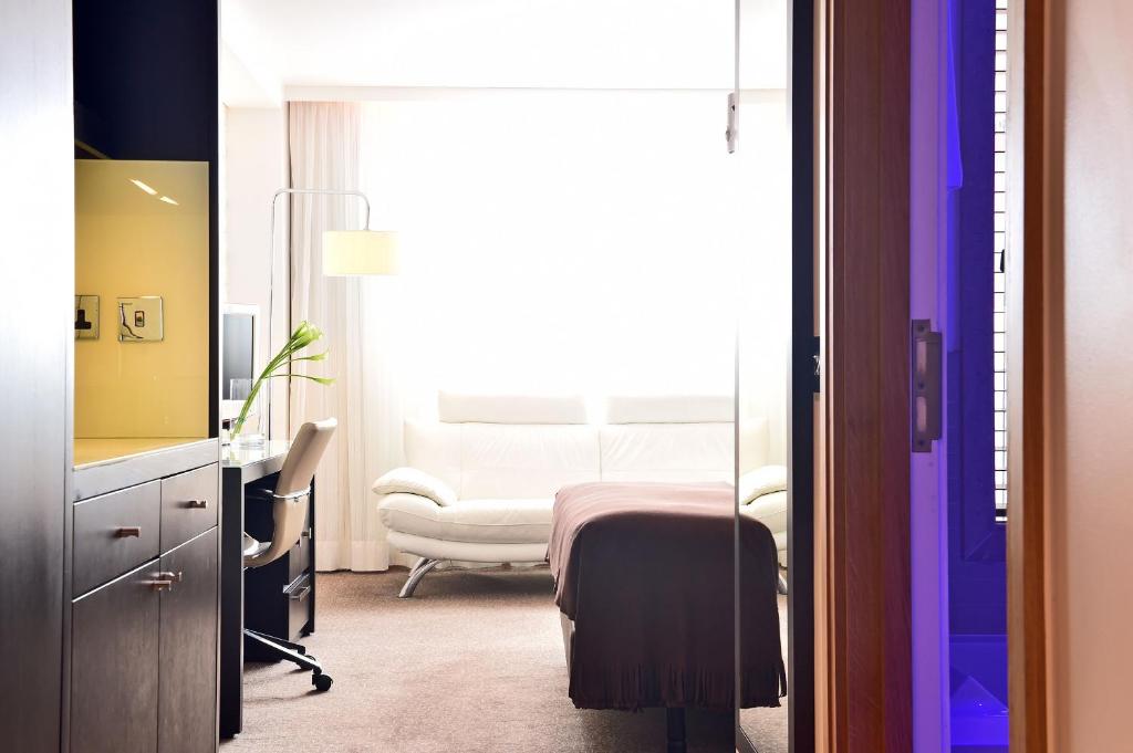 Postel nebo postele na pokoji v ubytování Pestana Chelsea Bridge Hotel & SPA