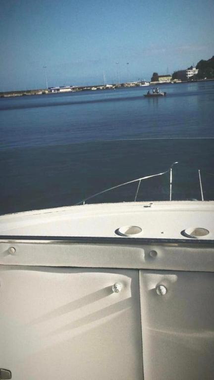 a boat sitting on a body of water at Thalassa in Katakolo