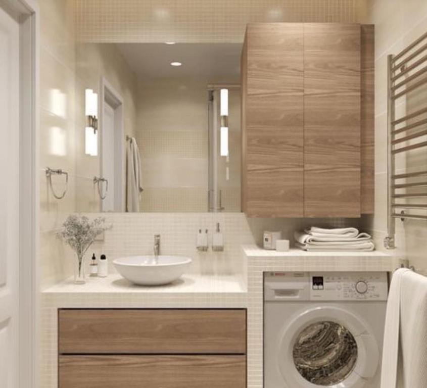 uma casa de banho com um lavatório e uma máquina de lavar roupa em Etkinlik motel em Marmara