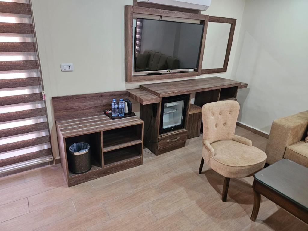 TV a/nebo společenská místnost v ubytování Sunset Hotel