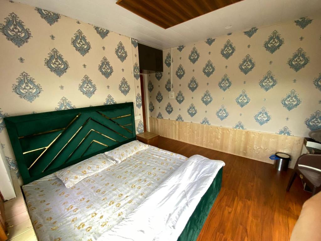 Postel nebo postele na pokoji v ubytování Sheen Homestay