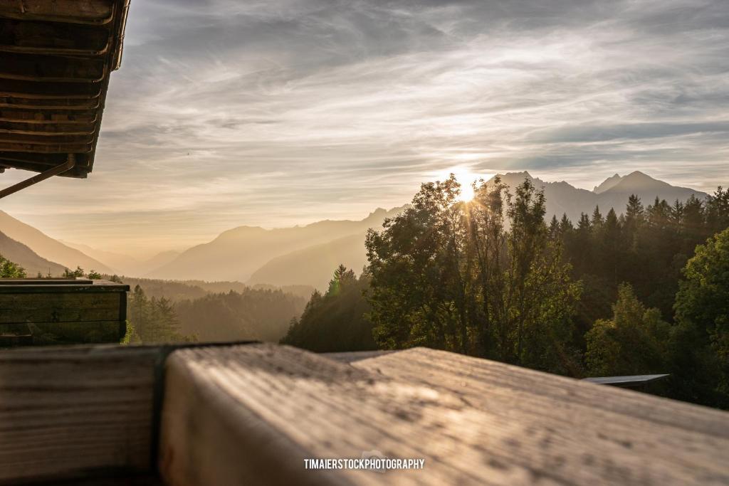 a view of the mountains from a balcony of a house at Landhaus Alpenblick in Obsteig