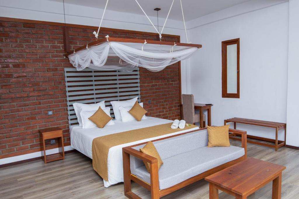 Postel nebo postele na pokoji v ubytování Dowa Elegance Resort