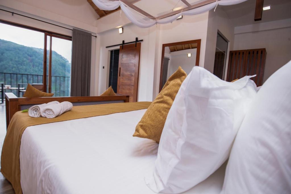 Postel nebo postele na pokoji v ubytování Dowa Elegance Resort