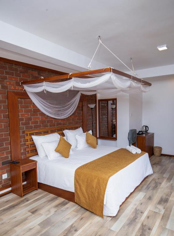 Postel nebo postele na pokoji v ubytování Dowa Elegance Resort