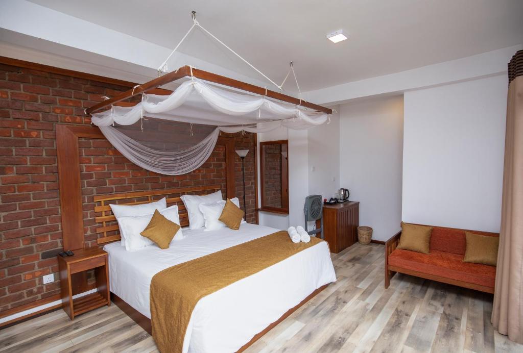 Postel nebo postele na pokoji v ubytování Dowa Elegance Resort