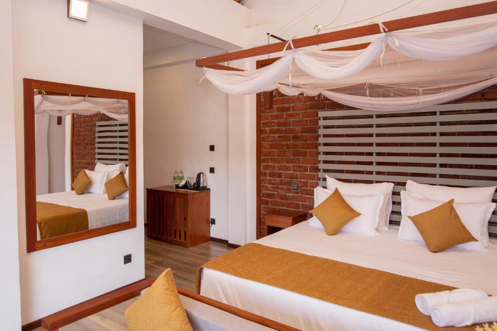 Postel nebo postele na pokoji v ubytování Dowa Elegance Resort