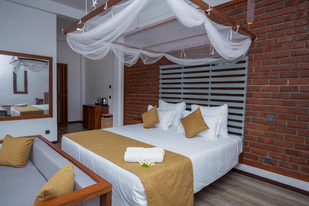Postel nebo postele na pokoji v ubytování Dowa Elegance Resort
