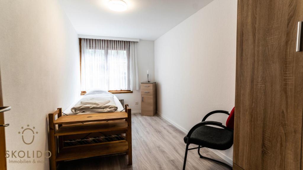 Postel nebo postele na pokoji v ubytování Gemütliches Ferienhaus Brigerbad