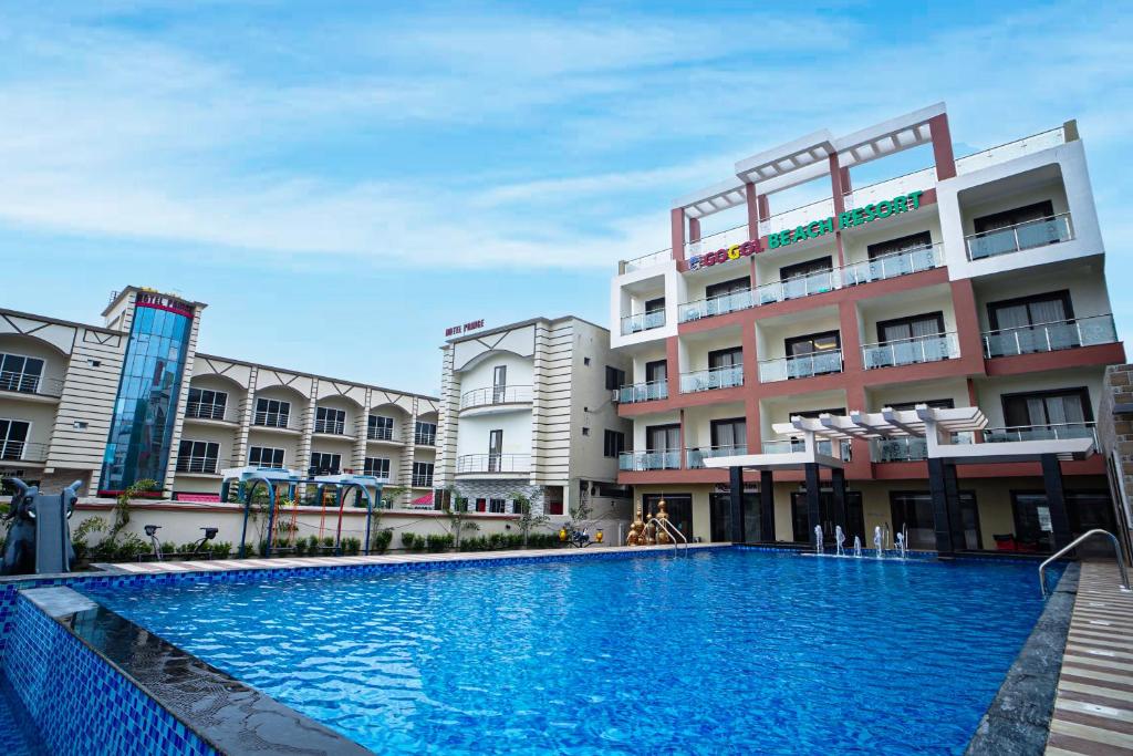 a large swimming pool in front of a building at Gogol Beach Resort !! Beach 1 Minute !! in Mandarmoni