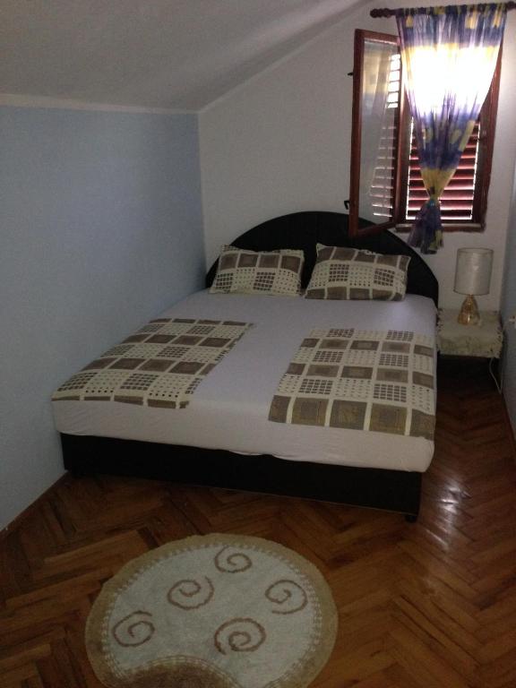 Postel nebo postele na pokoji v ubytování Apartments Aleksic