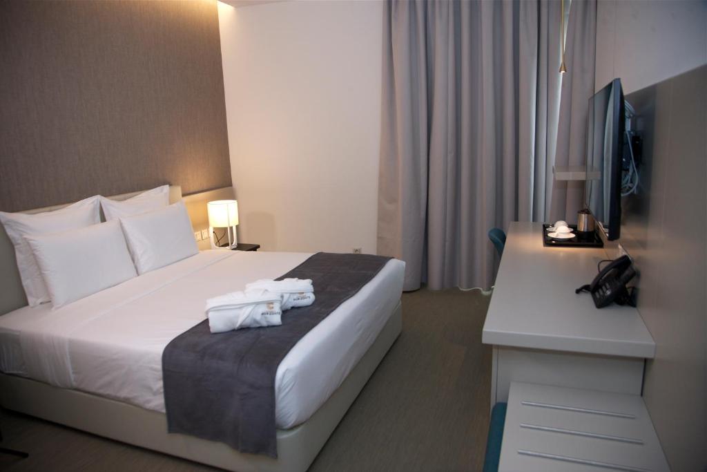 En eller flere senge i et værelse på Hotel Continental Horizonte