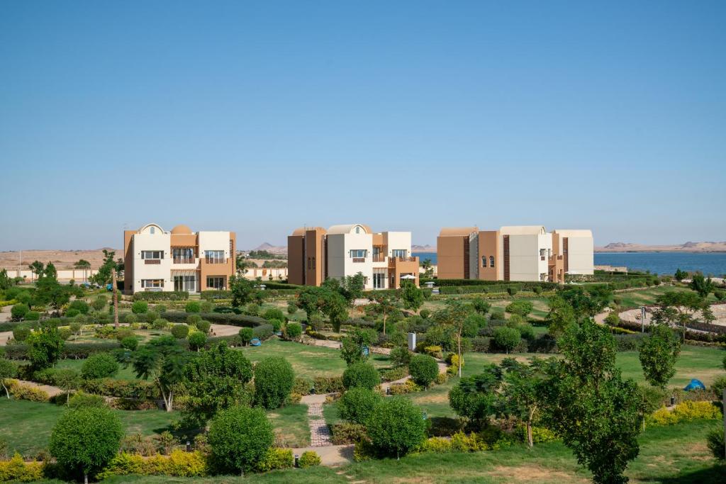 an aerial view of a park with buildings and trees at Azal Lagoons Resort Abu Simbel in Abu Simbel