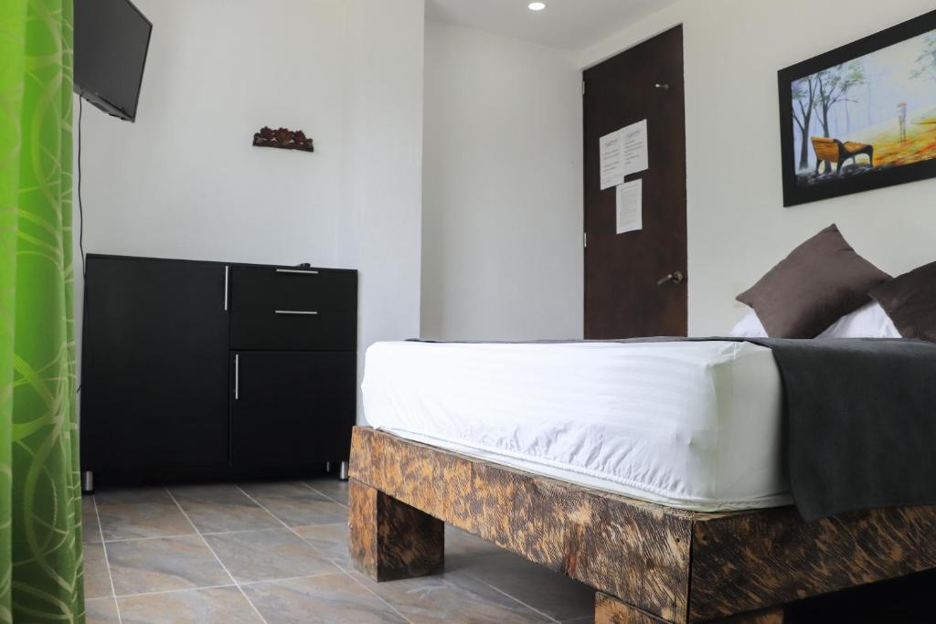 Postel nebo postele na pokoji v ubytování Hosteria La Medusa