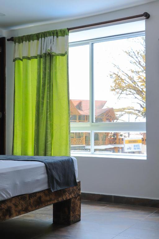 Postel nebo postele na pokoji v ubytování Hosteria La Medusa