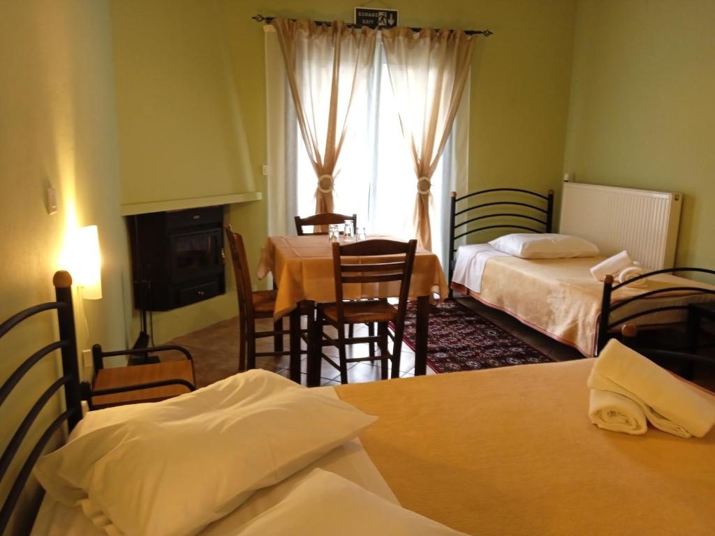 Postel nebo postele na pokoji v ubytování Guesthouse Eleftherios
