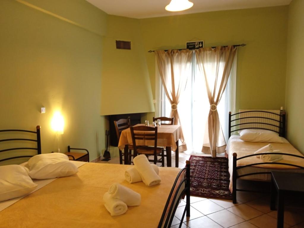 Postel nebo postele na pokoji v ubytování Guesthouse Eleftherios