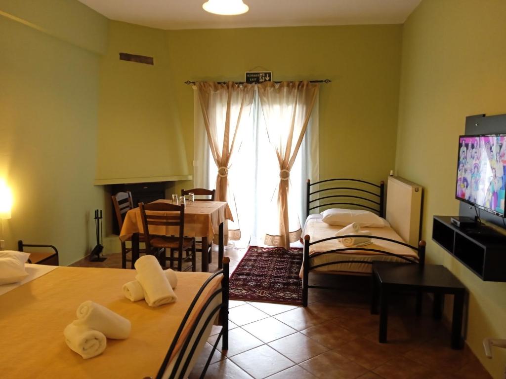 TV a/nebo společenská místnost v ubytování Guesthouse Eleftherios