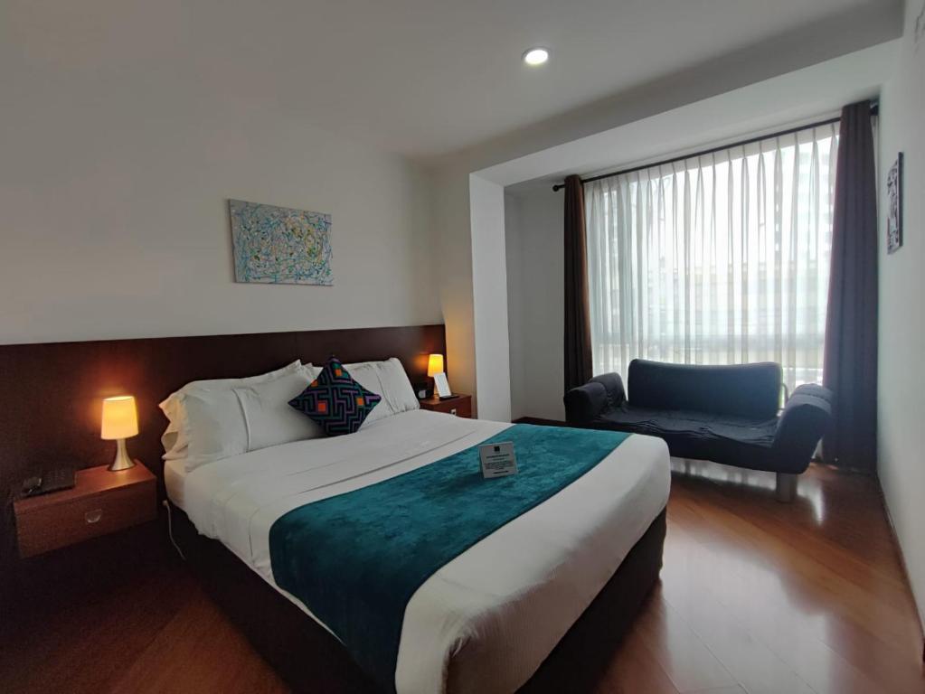 Postel nebo postele na pokoji v ubytování Hotel Casa Galvez