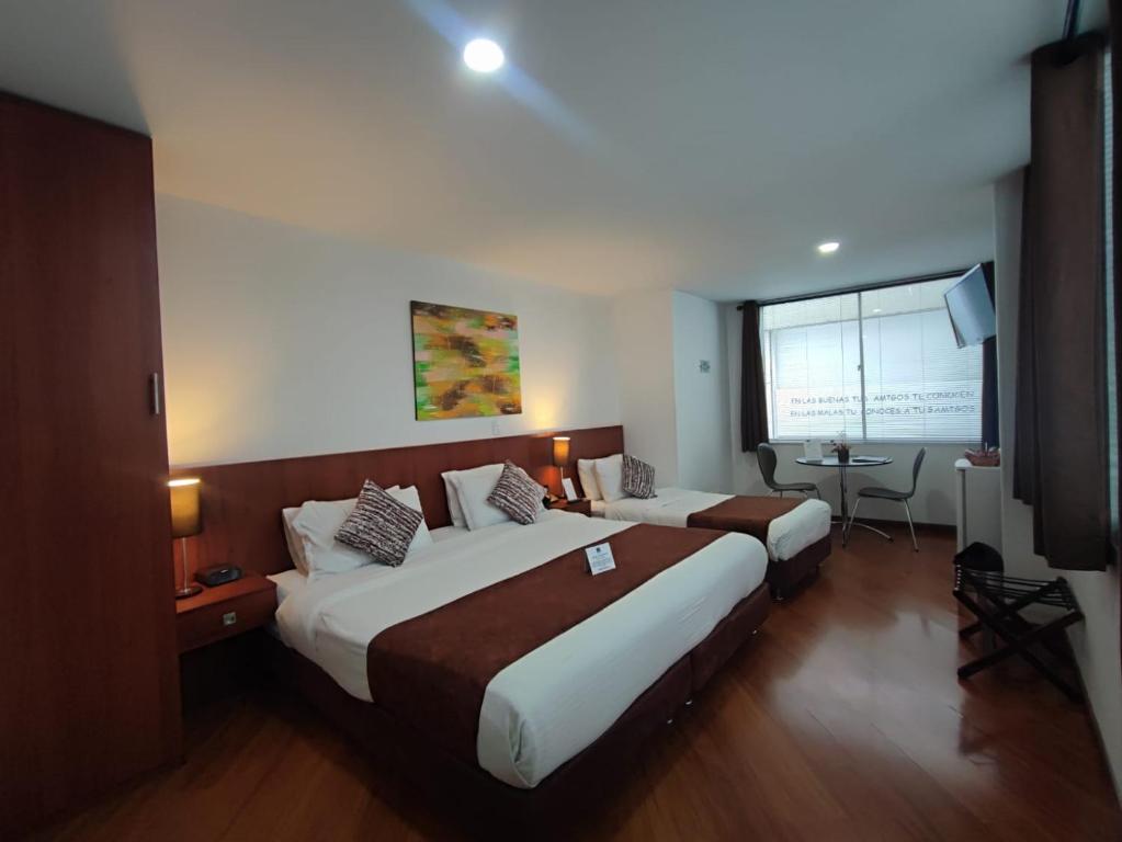 Postel nebo postele na pokoji v ubytování Hotel Casa Galvez