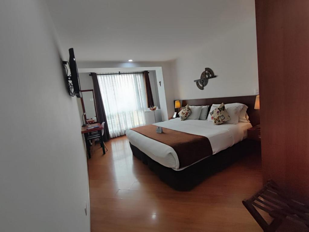 Postel nebo postele na pokoji v ubytování Hotel Casa Galvez