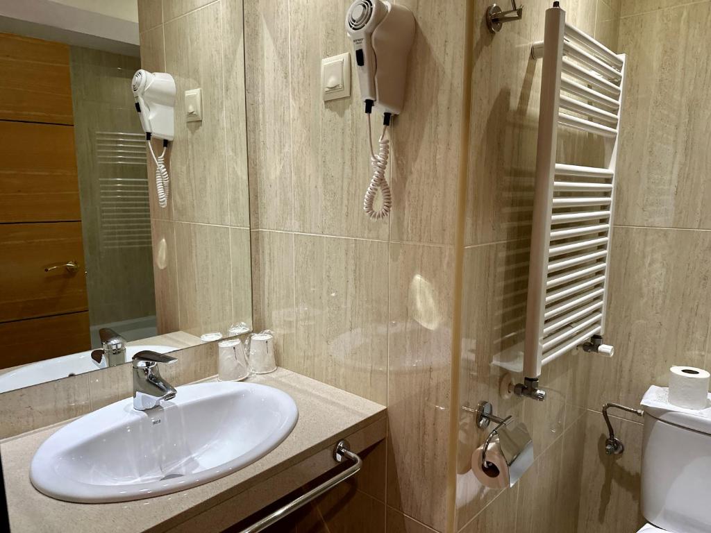 Koupelna v ubytování Hotel Micolau