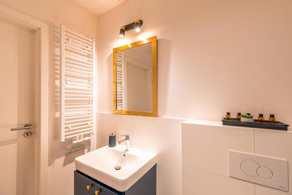 Kúpeľňa v ubytovaní Apartament Chmielna Gold