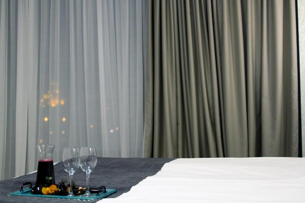 Postel nebo postele na pokoji v ubytování Brooch Boutique Hotel