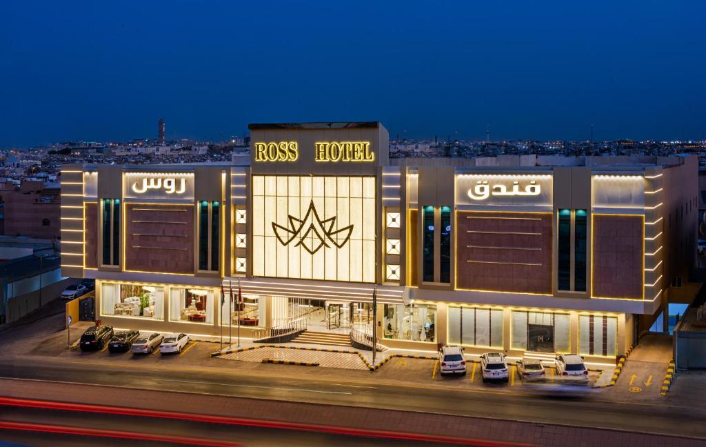 a building with a sign on the side of it at Ross Hotel in Riyadh